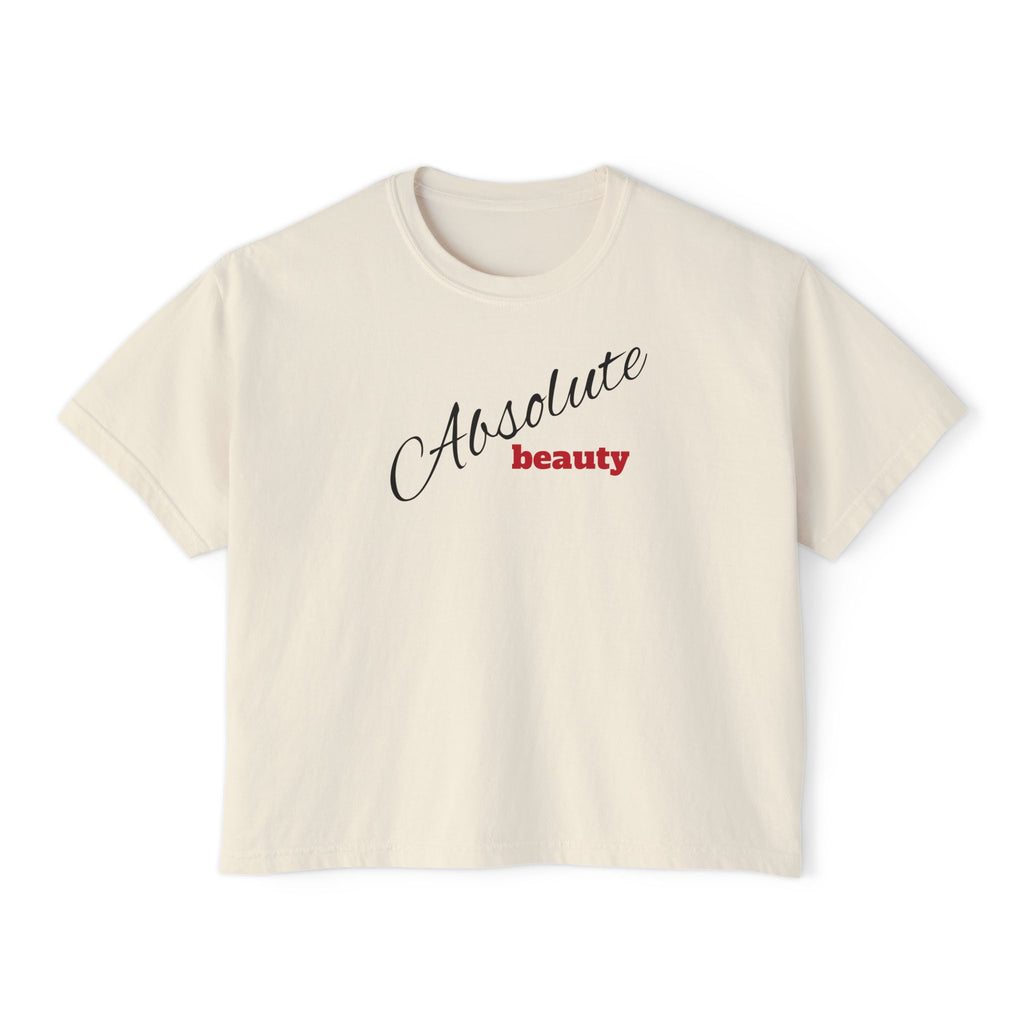 Beige t-shirt with 'Absolute beauty' text on a white background