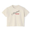 Beige t-shirt with 'Absolute beauty' text on a white background